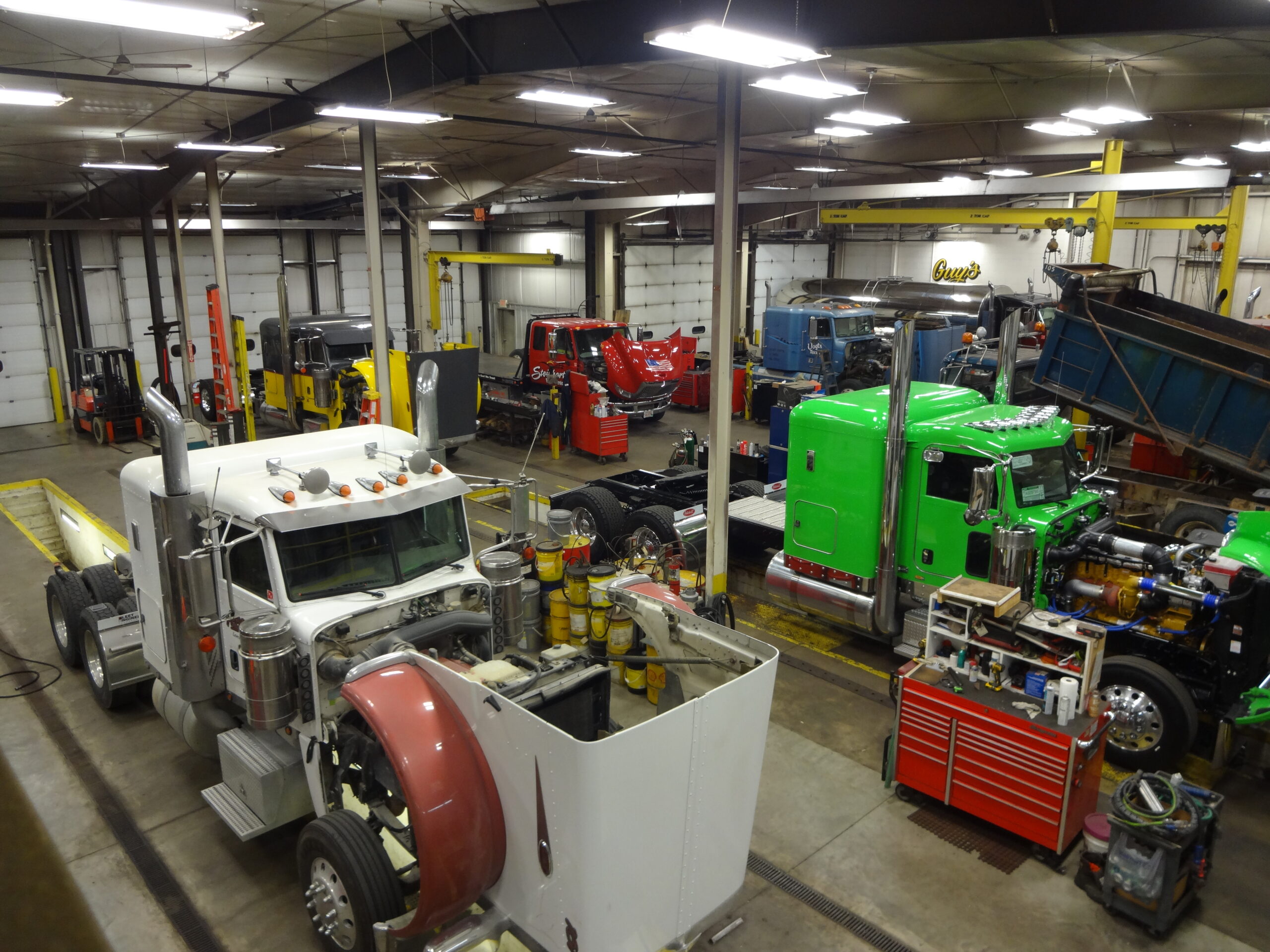 Commercial trucks in a repair workshop